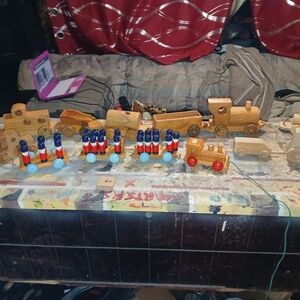 Wooden Pull-Along Train Set with Blue and Red soldiers trains all different
